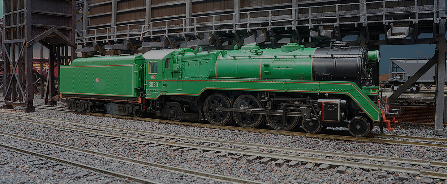3830 in dark green with black smoke box taking on coal at Werris Creek.